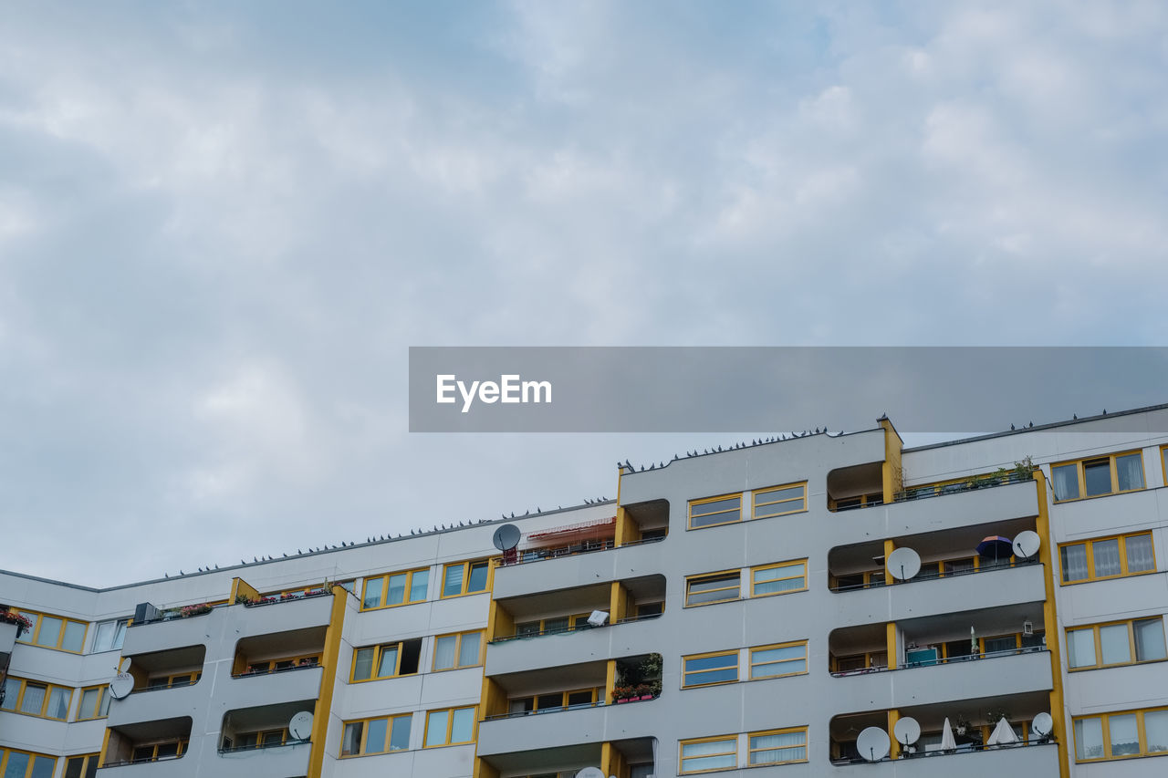 LOW ANGLE VIEW OF RESIDENTIAL BUILDINGS AGAINST SKY