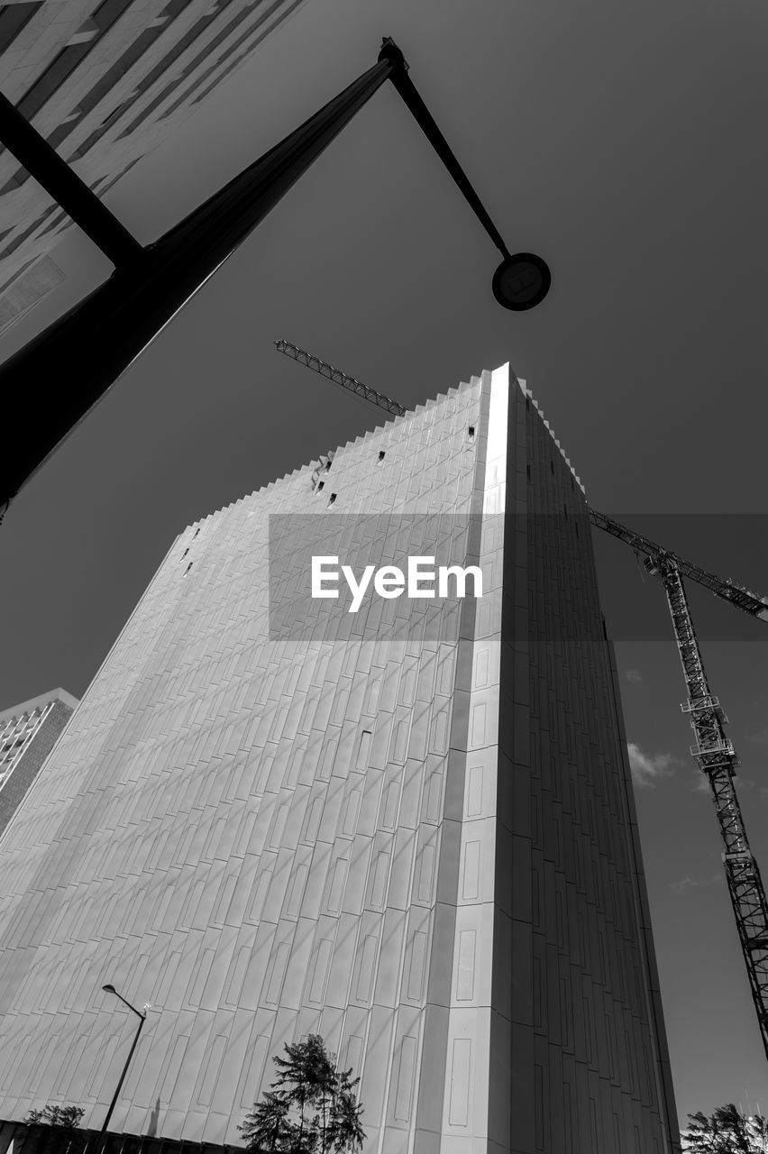 LOW ANGLE VIEW OF BUILDINGS AGAINST SKY