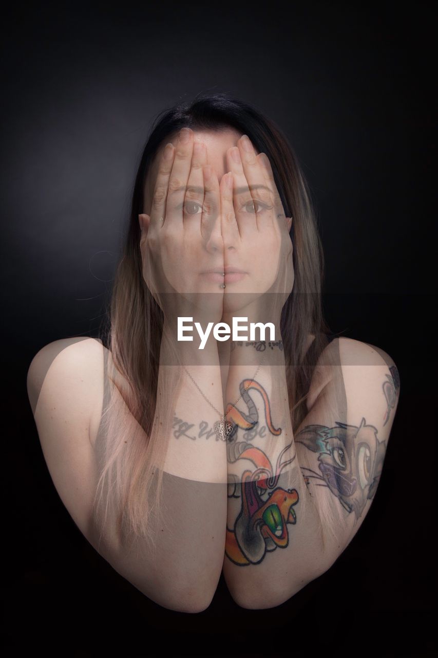 Multiple image of young woman standing against black background