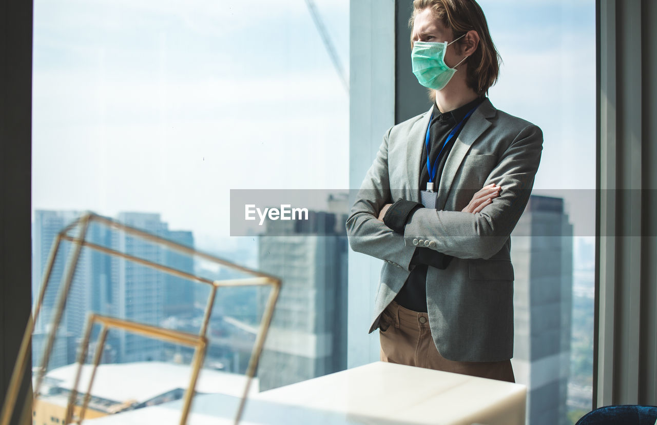 Man standing by window