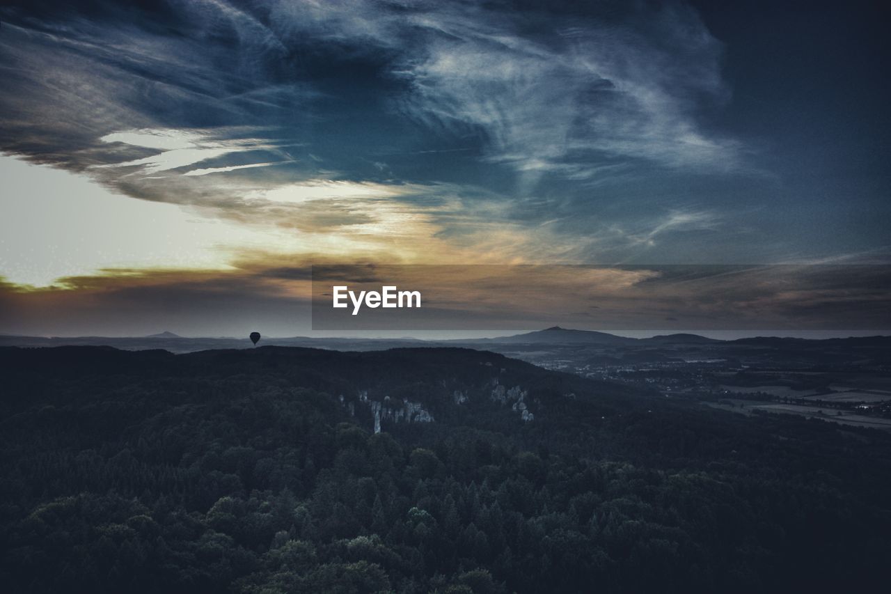 Scenic view of silhouette landscape against sky during sunset