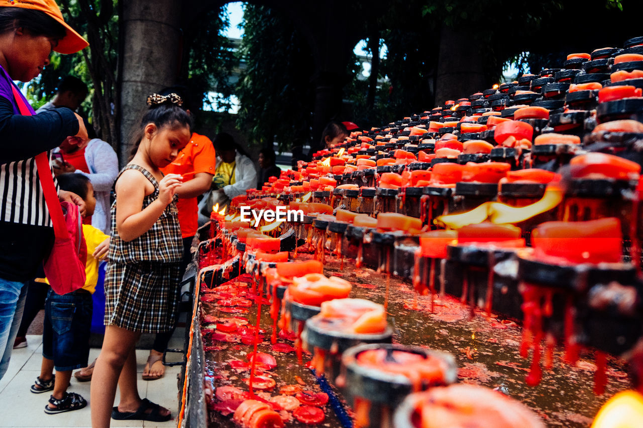 GROUP OF PEOPLE IN TEMPLE