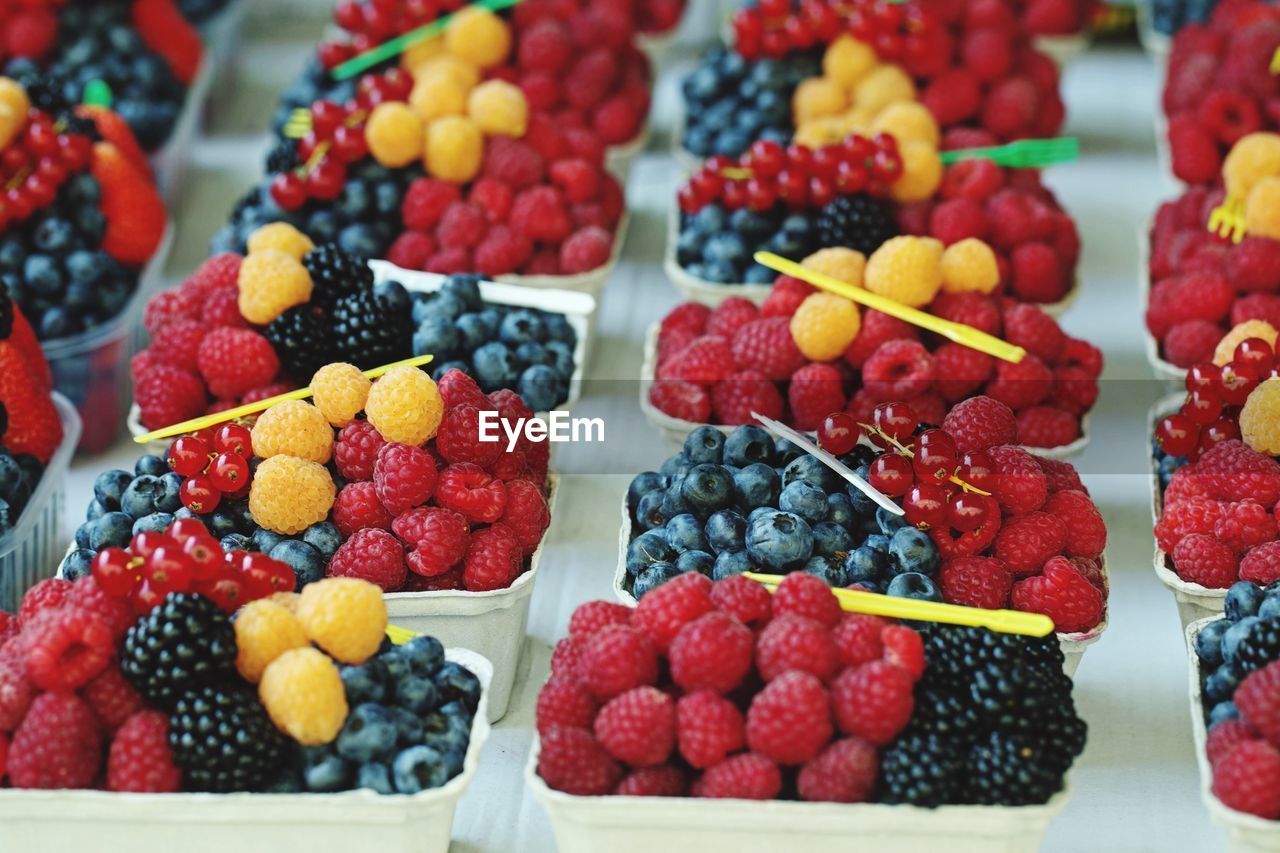 High angle view of fruits in containers on table