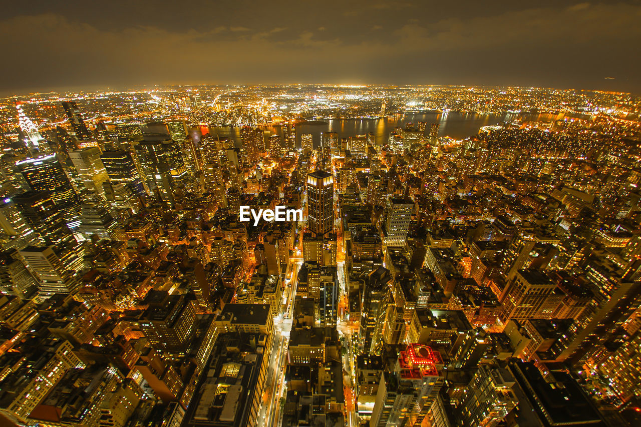 high angle view of illuminated cityscape at night