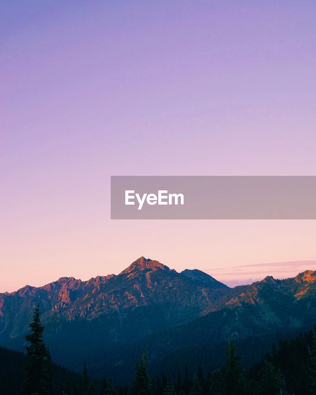 Scenic view of mountains against dramatic sky