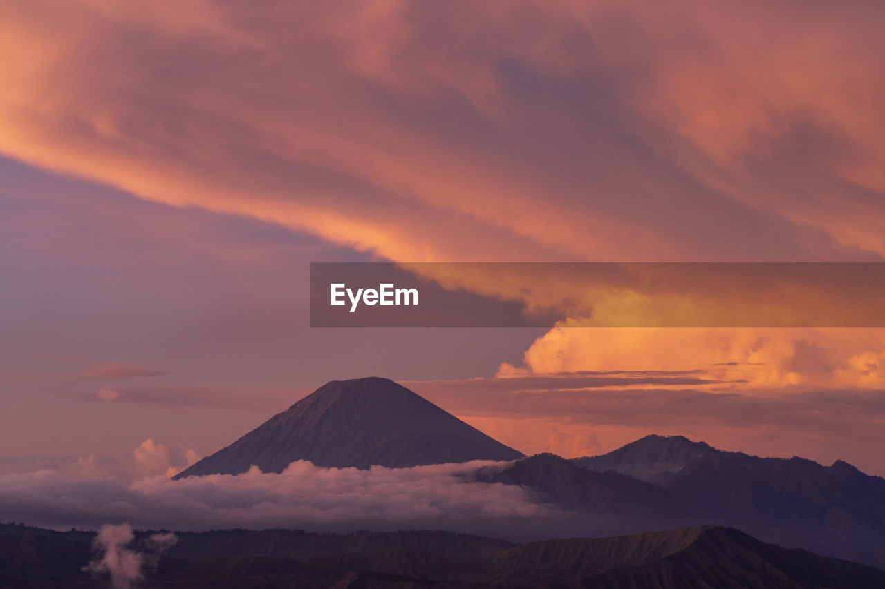 Scenic view of mountains against sky during sunset