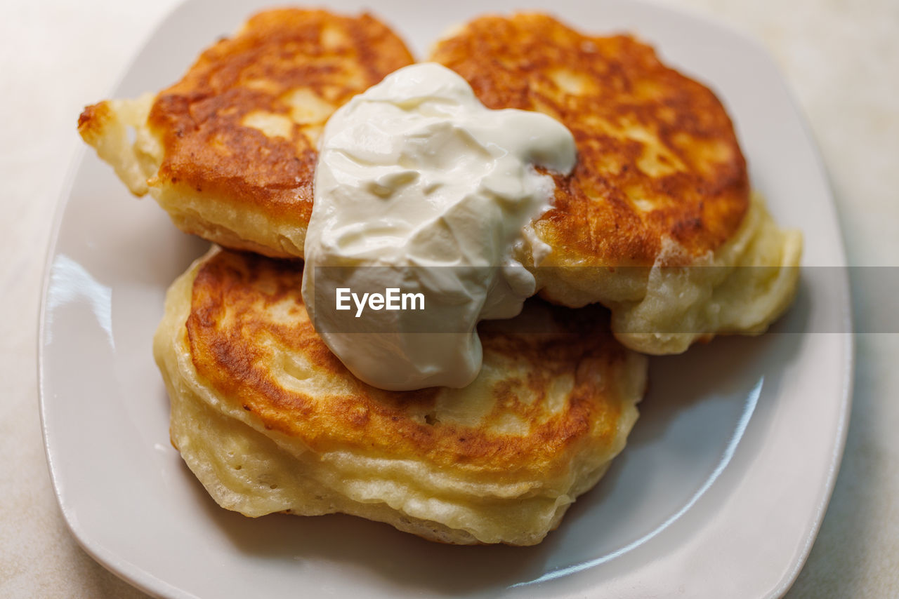 food and drink, food, meal, dish, fast food, breakfast, plate, freshness, produce, no people, baked, healthy eating, close-up, sweet food, cuisine, indoors, bread, dessert, brunch, dairy, fried food, potato pancake, sweet, fruit, high angle view, still life, toasted bread