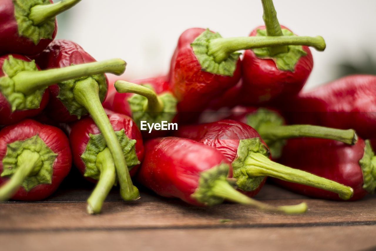 Close-up of chili peppers on table