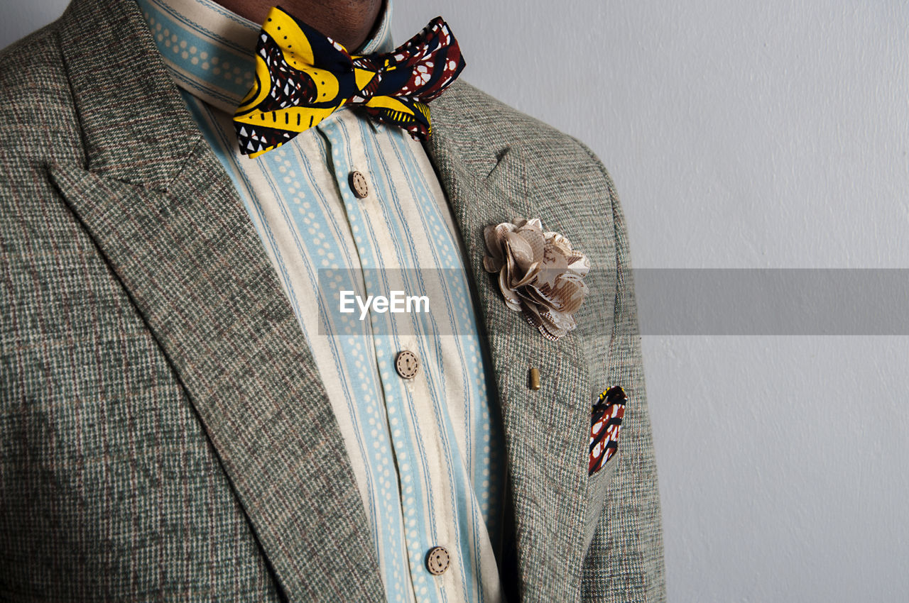 Close-up midsection of man wearing blazer