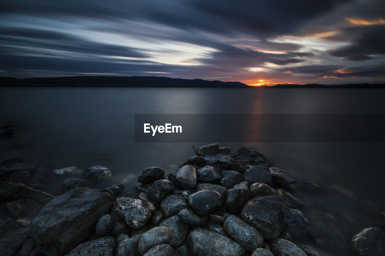 Scenic view of sea against sky during sunset