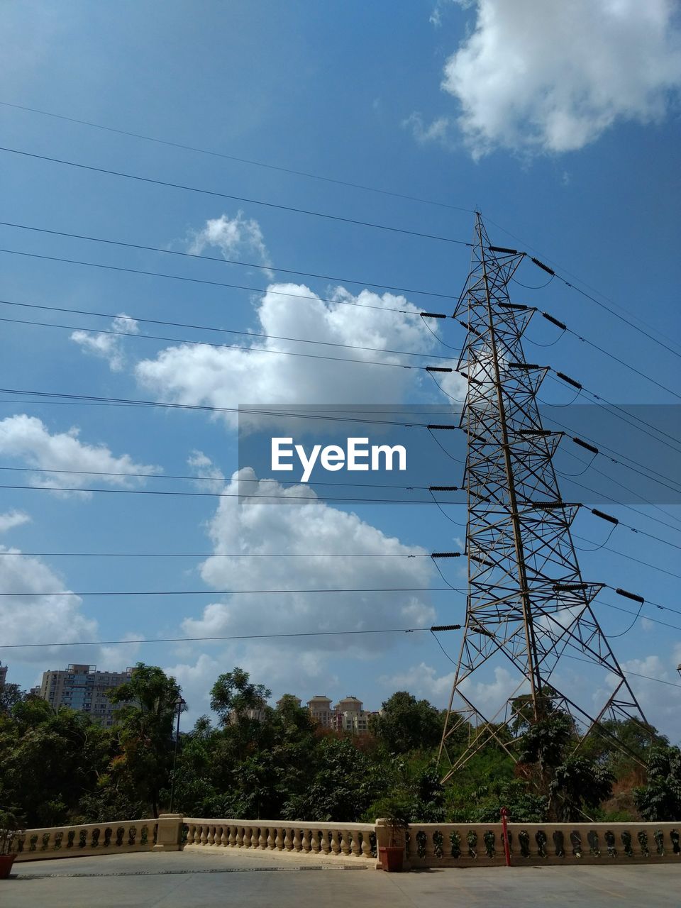 LOW ANGLE VIEW OF BIRDS AND ELECTRICITY PYLON AGAINST SKY