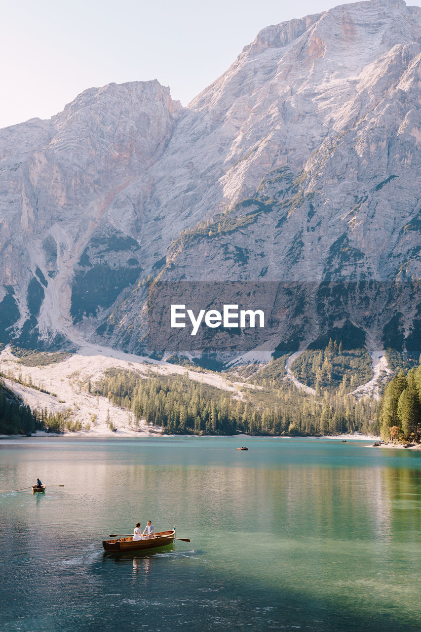 SCENIC VIEW OF LAKE BY MOUNTAIN