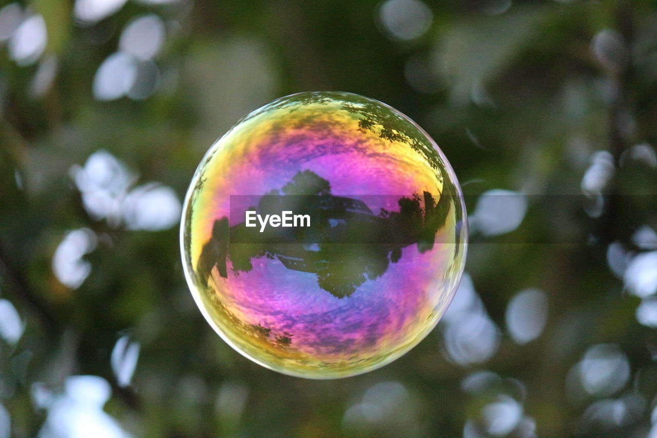 CLOSE-UP OF BUBBLES WITH REFLECTION