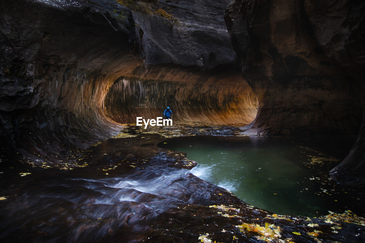 View of river flowing amidst canyon