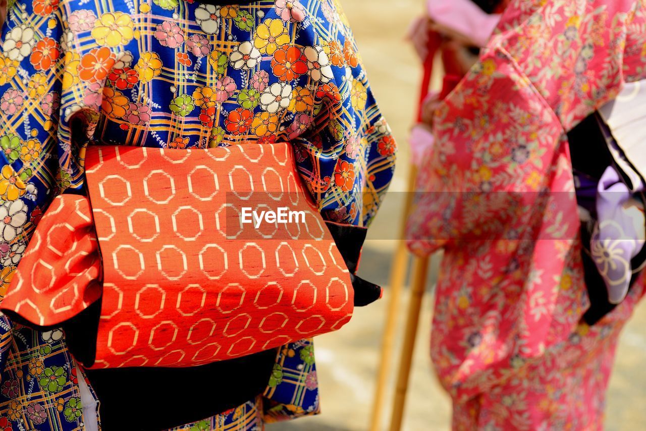 Rear view of women in traditional clothing