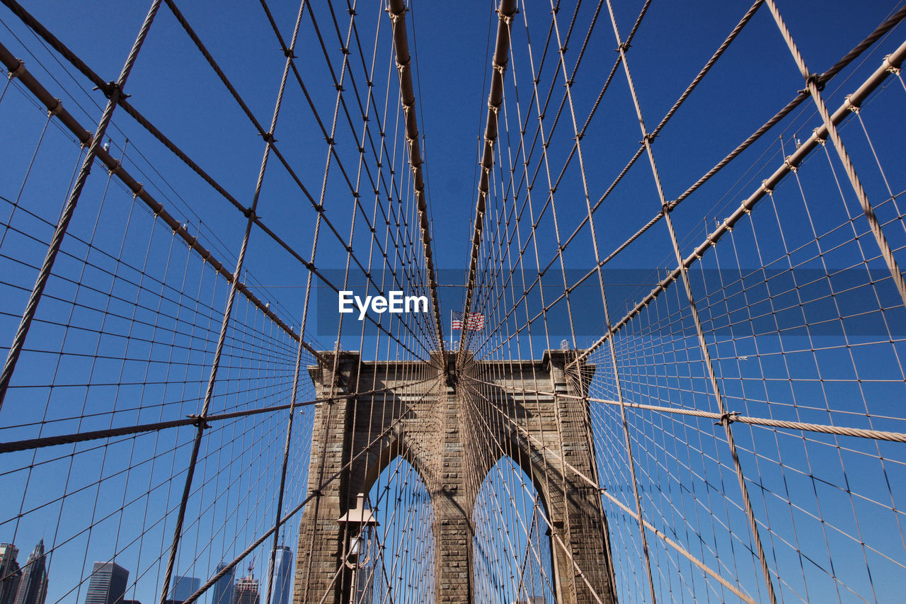 Low angle view of brooklyn bridge against clear sky