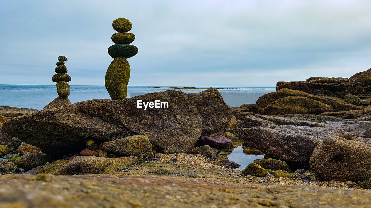 STACK OF ROCKS ON SHORE