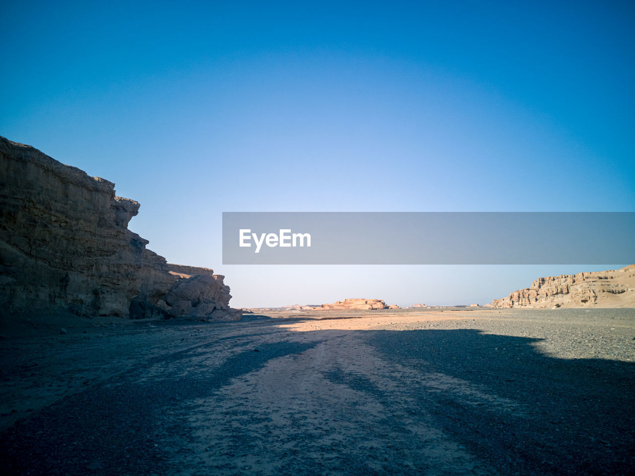 Rock formations against clear blue sky