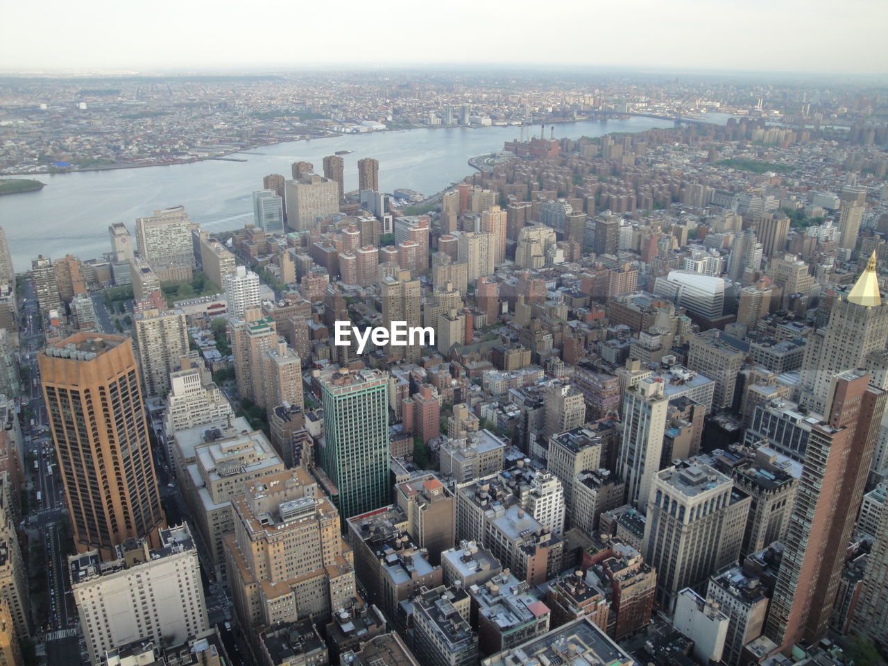 High angle view of modern buildings in city against sky