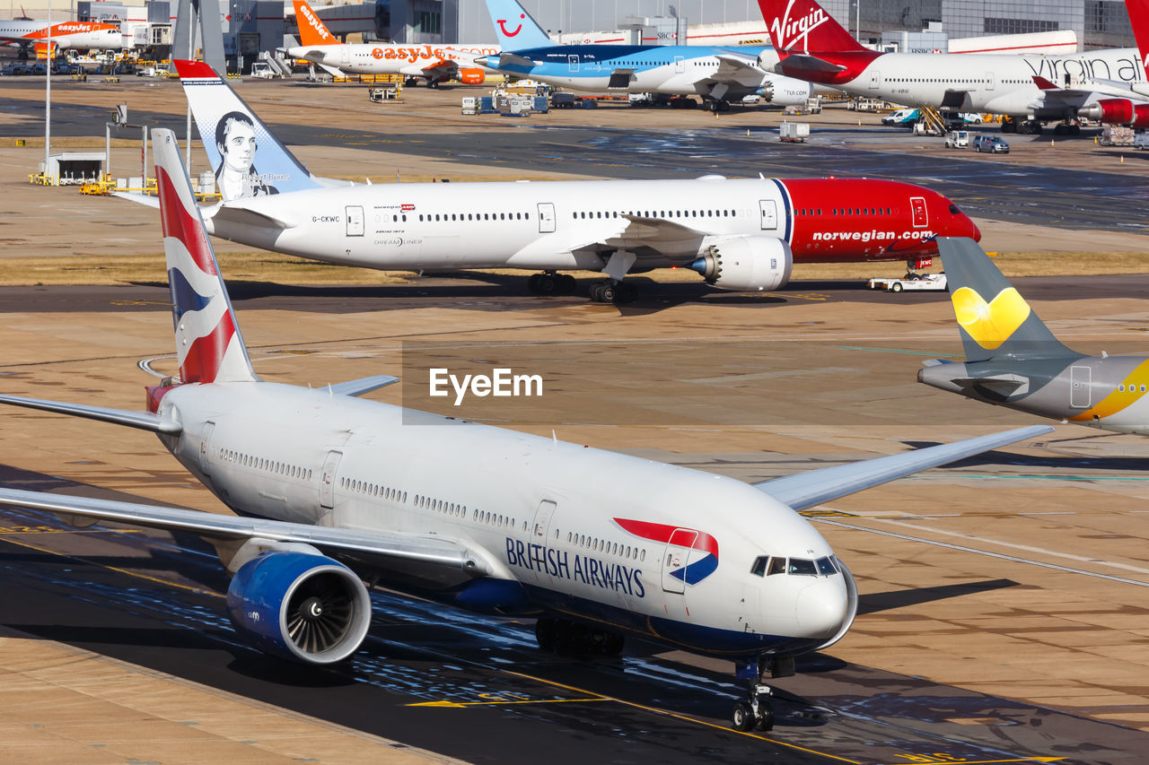 HIGH ANGLE VIEW OF AIRPLANE ON RUNWAY