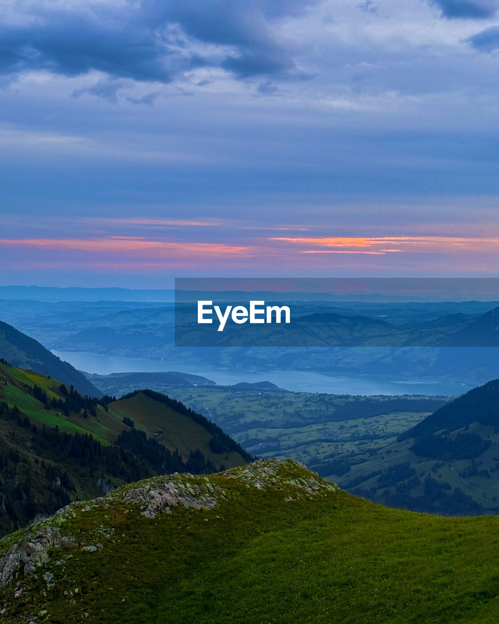 Scenic view of mountains against sky during sunset