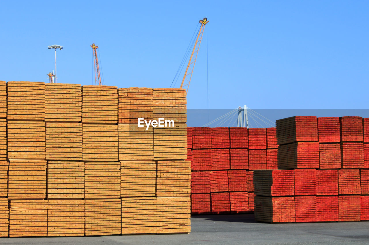 Stack of building against clear blue sky