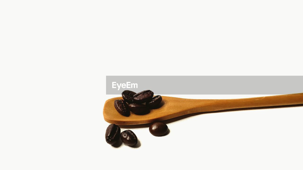 CLOSE-UP OF BLACK COFFEE ON WHITE BACKGROUND