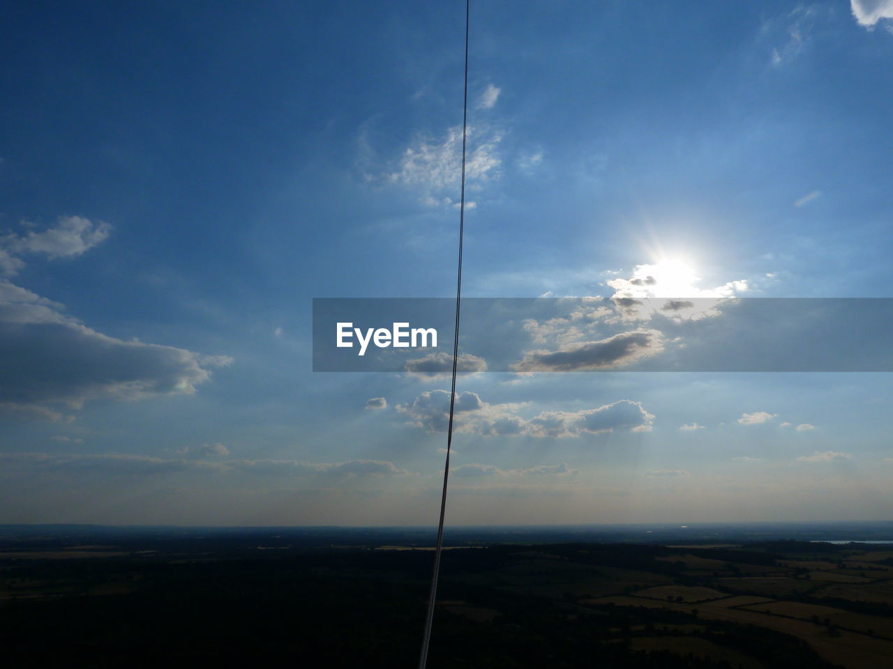 ELECTRICITY PYLON ON LAND AGAINST SKY