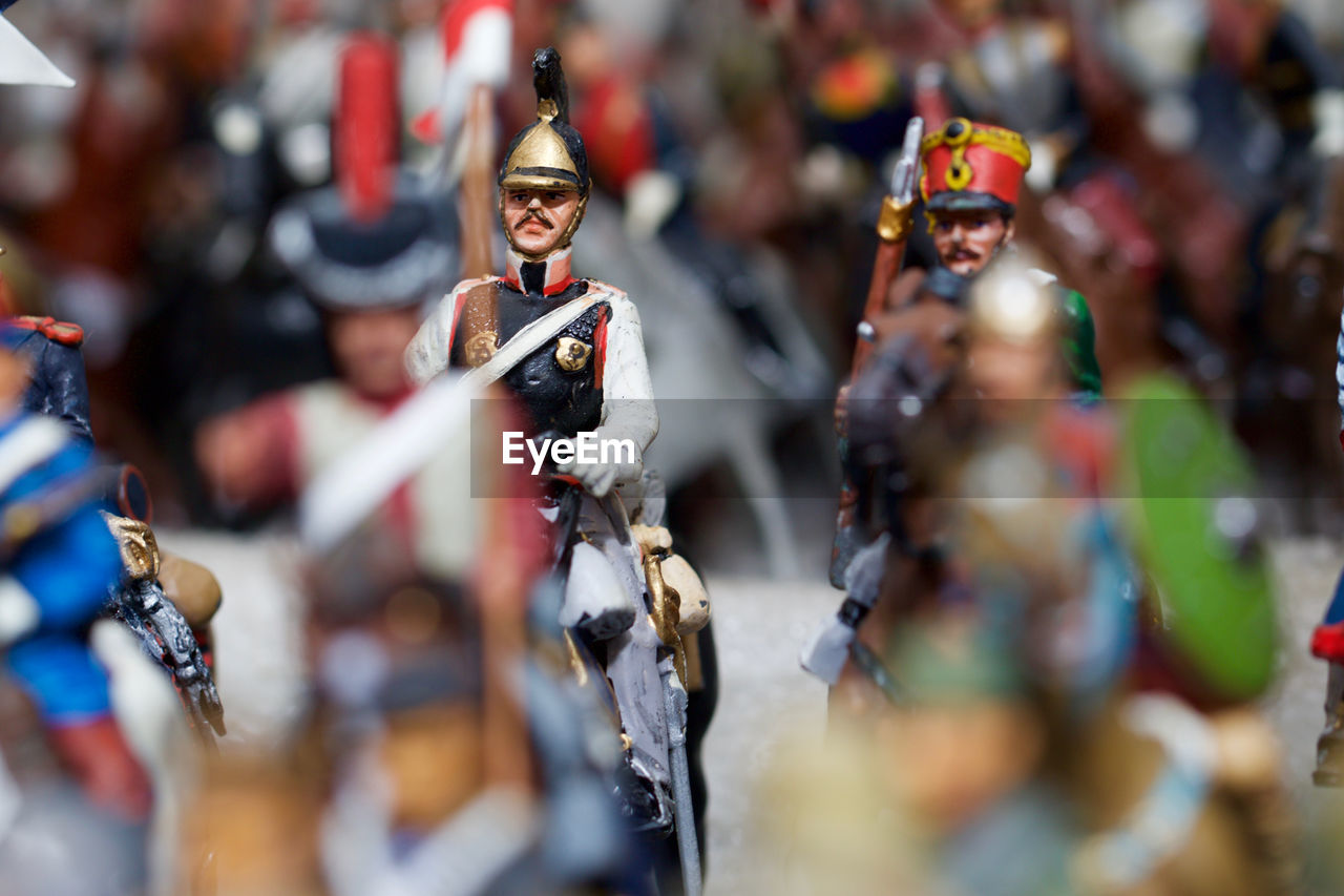 Close-up of figurines against blurred background