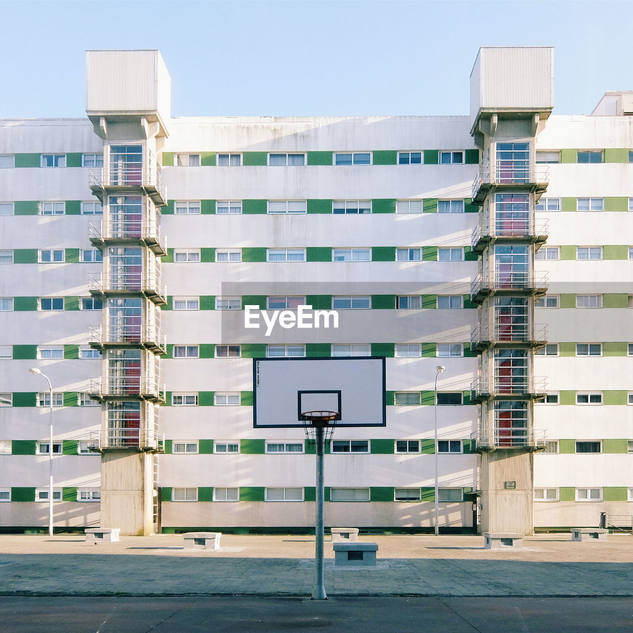 Basketball hoop against building