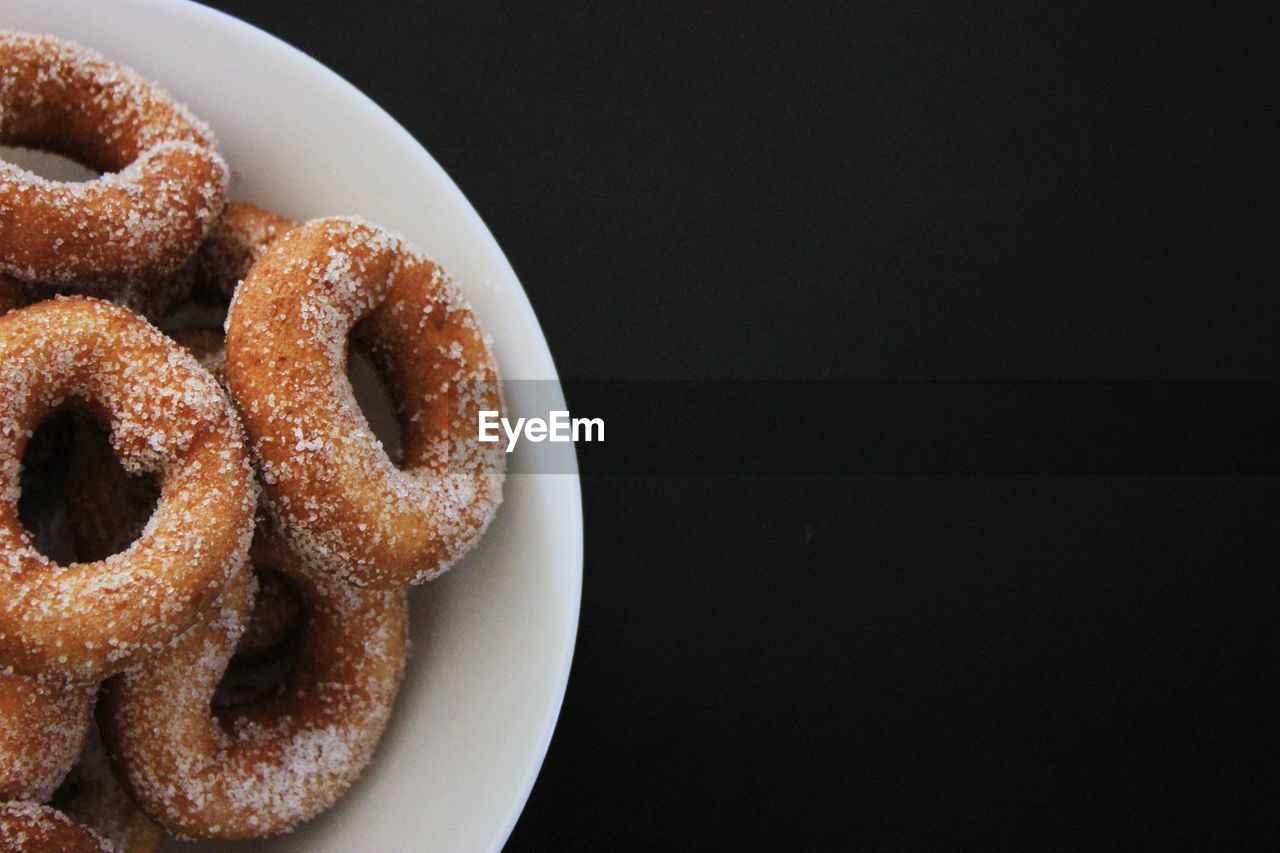 High angle view of donuts in plate on table