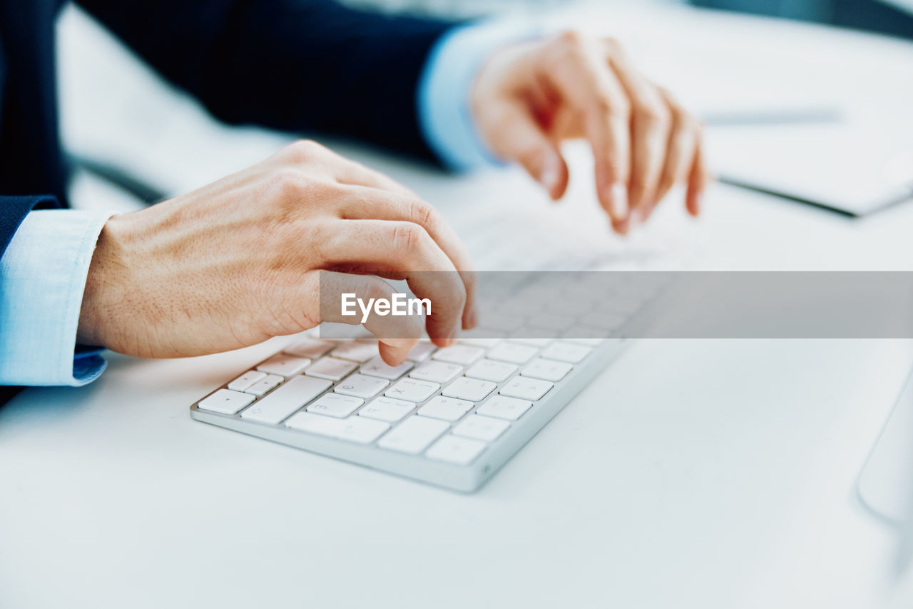 Man using laptop on table