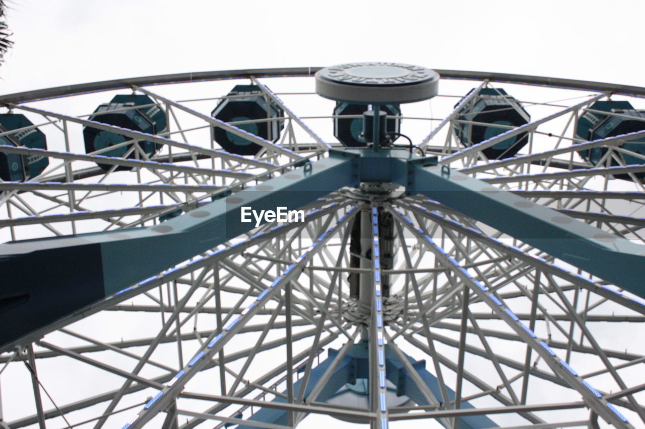 LOW ANGLE VIEW OF FERRIS WHEEL AGAINST THE SKY