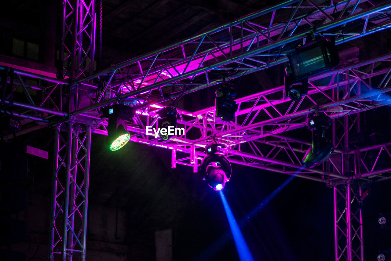 LOW ANGLE VIEW OF ILLUMINATED LANTERNS HANGING ON CEILING