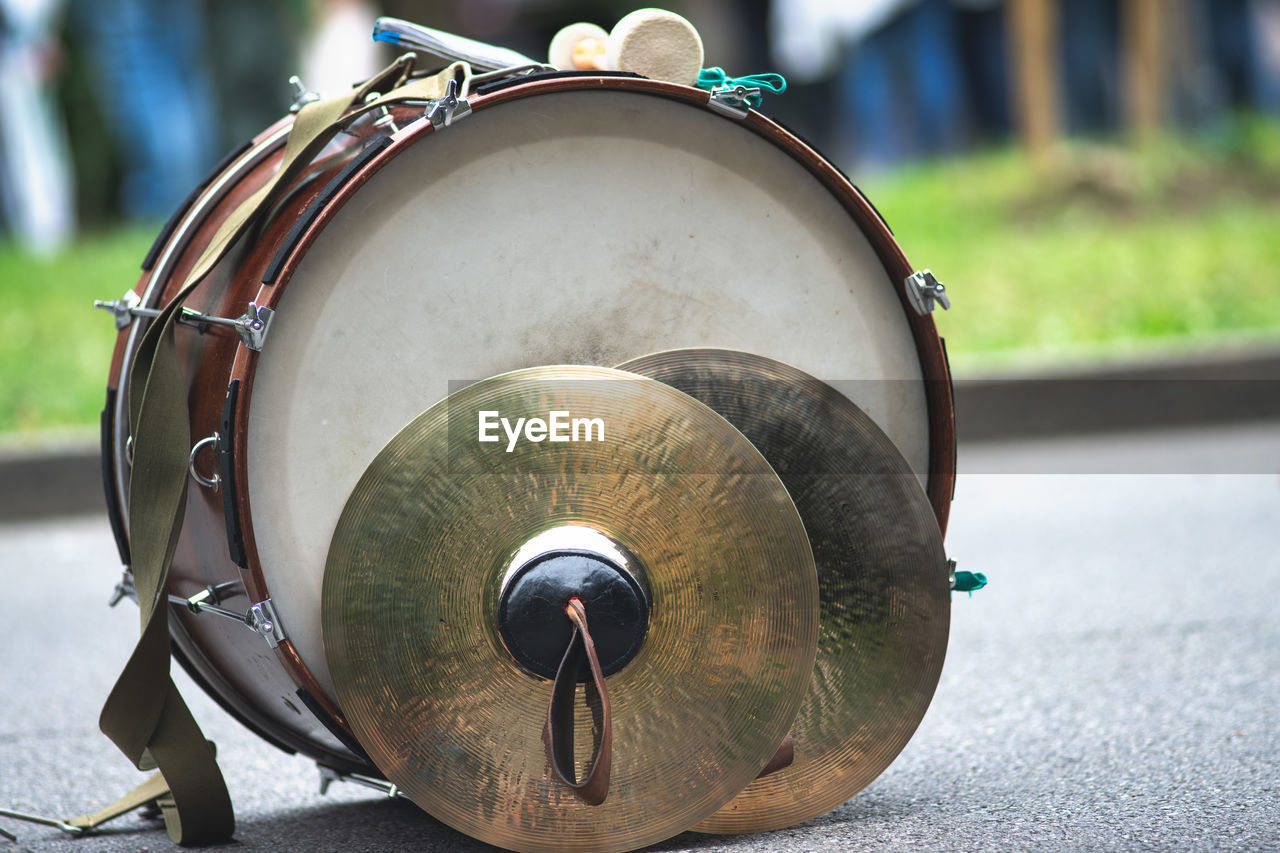 Close-up of musical instrument on road