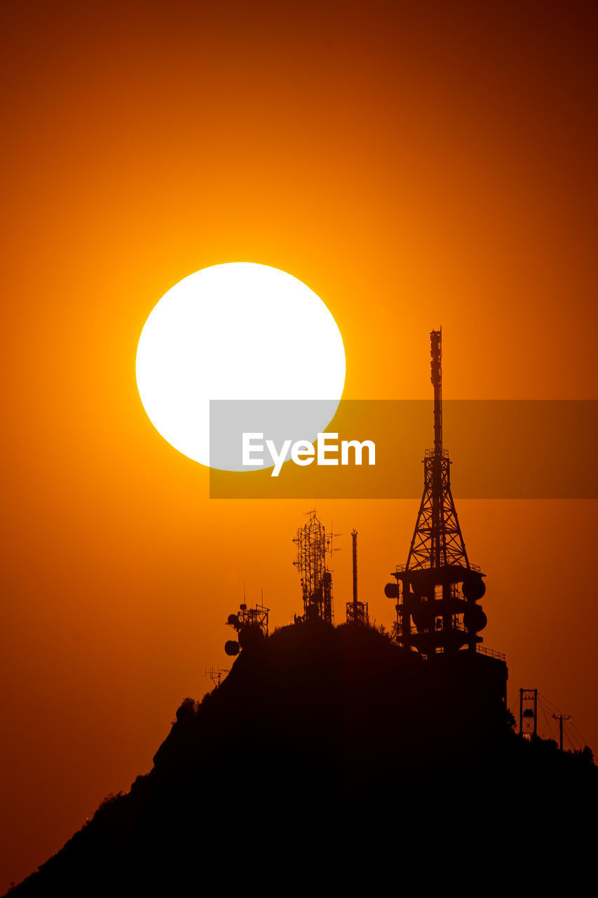 horizon, sky, silhouette, sunset, sun, architecture, nature, built structure, industry, afterglow, orange color, technology, dawn, no people, beauty in nature, evening, outdoors, environment, power generation, sunlight, scenics - nature, landscape, building exterior, travel destinations