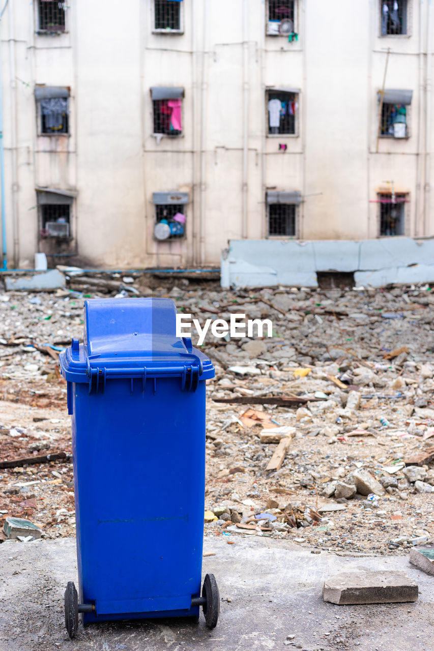 GARBAGE CAN ON BUILDING