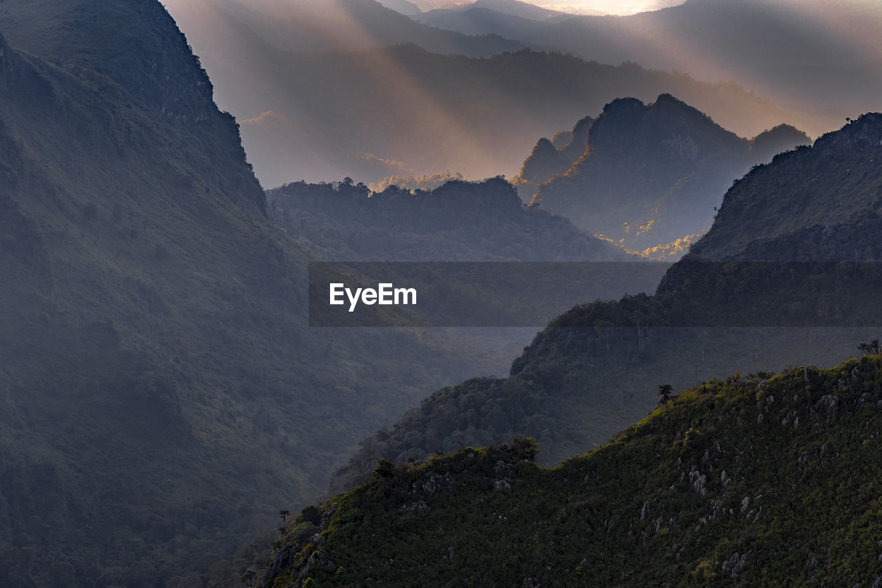 Scenic view of mountains against sky during sunset