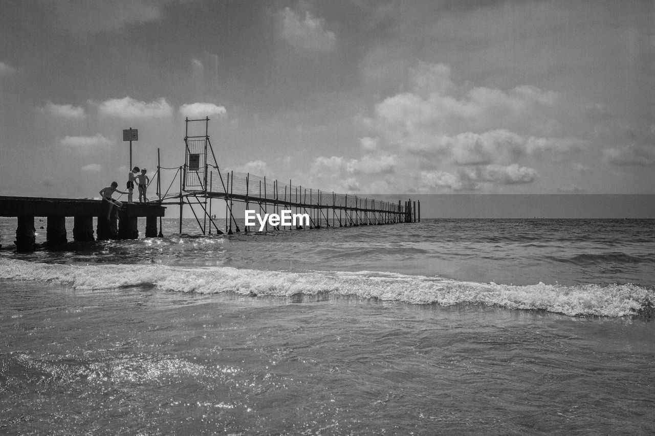 Pier over sea against sky