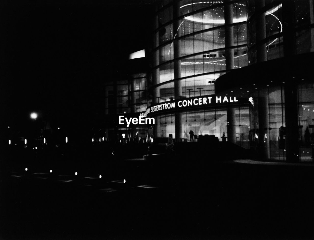 VIEW OF ILLUMINATED CITY AT NIGHT