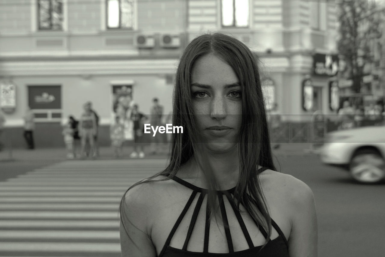 Portrait of beautiful woman in city