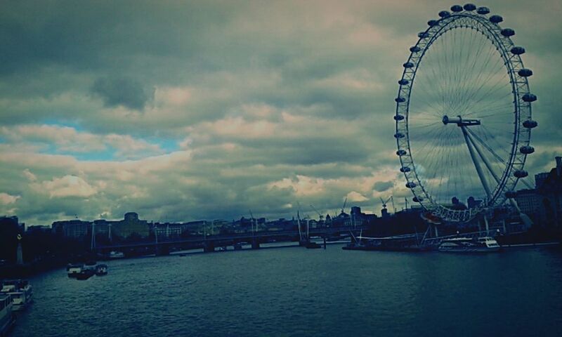 VIEW OF RIVER AGAINST CLOUDY SKY