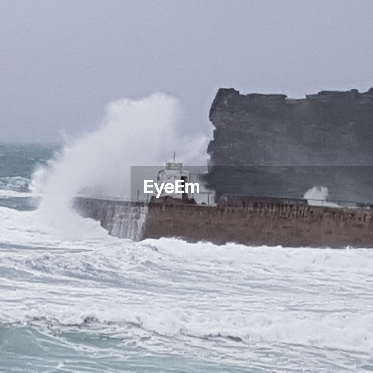 View of waves in sea against sky