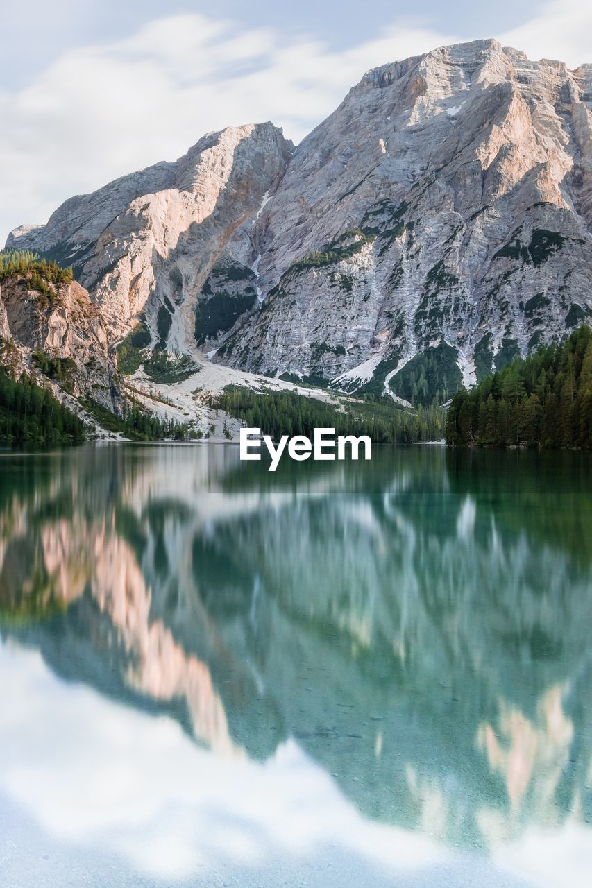 Scenic view of lake and mountains against sky