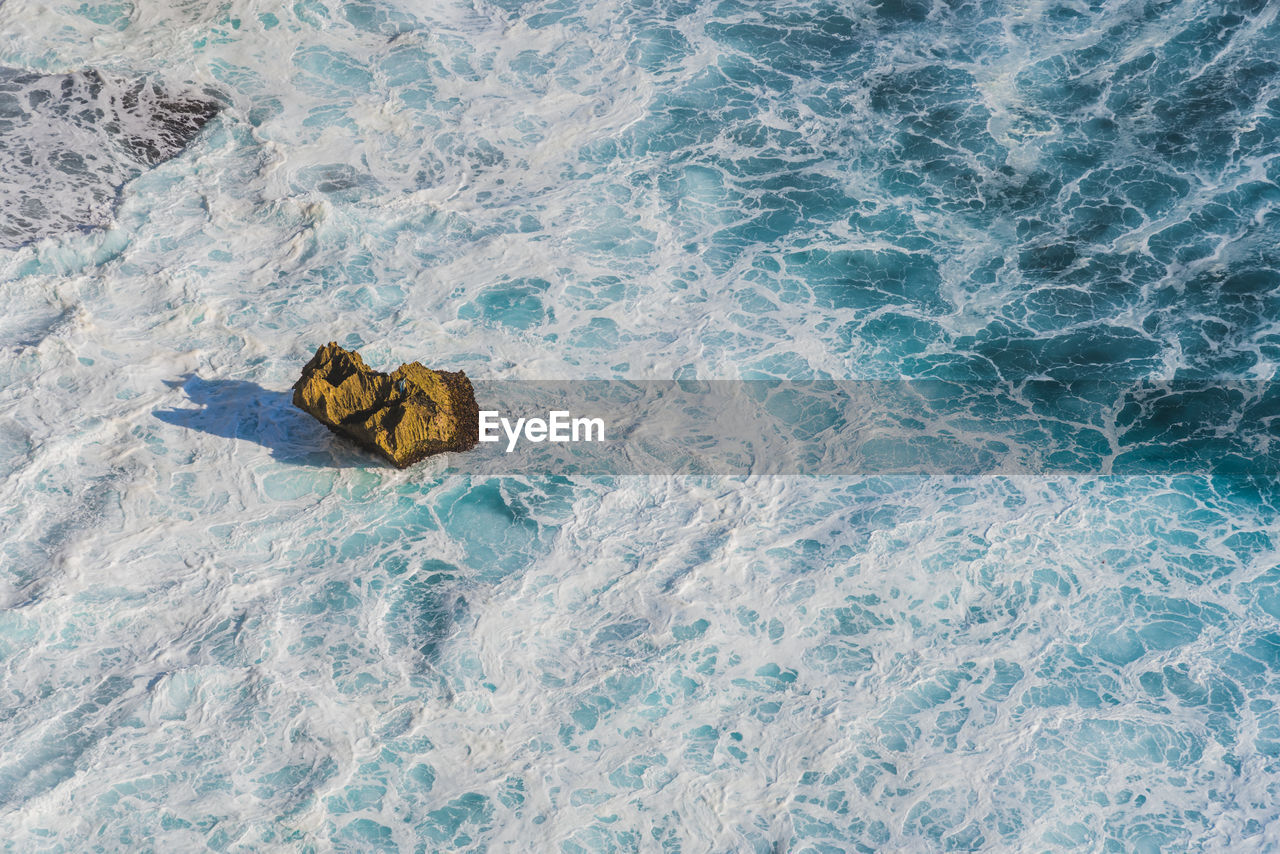 High angle view of waves in sea