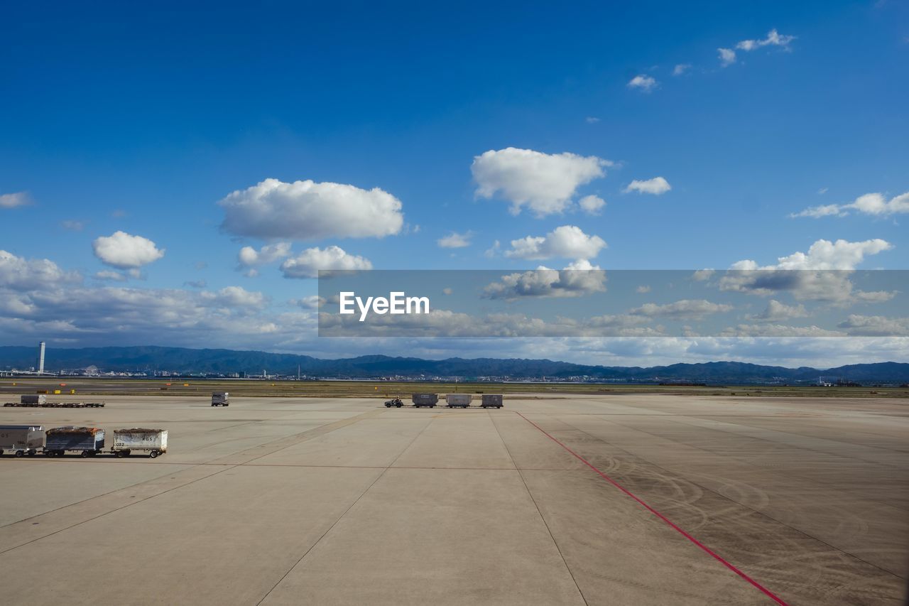 VIEW OF AIRPORT RUNWAY AGAINST SKY