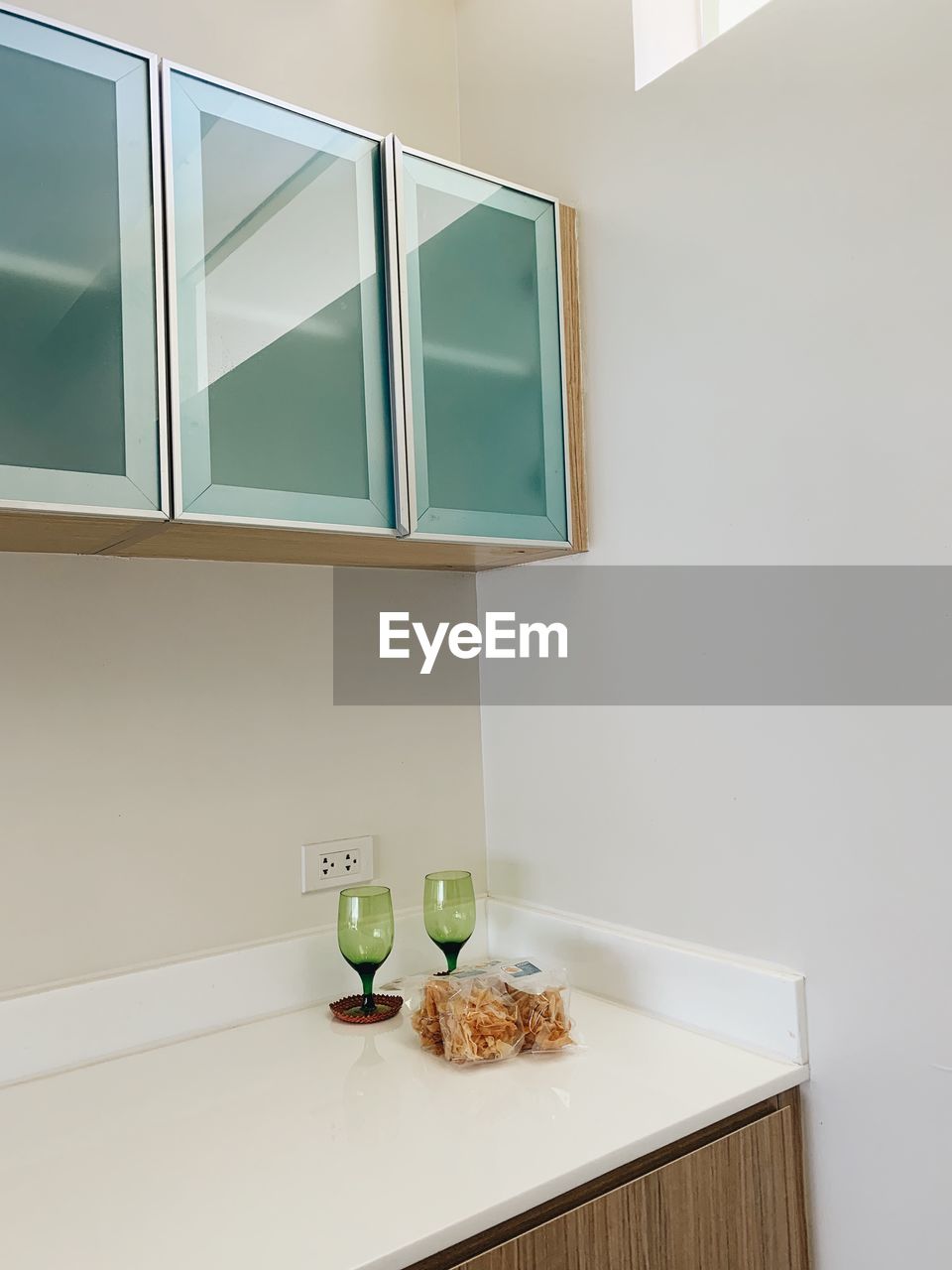 Various fruits on table against wall at home