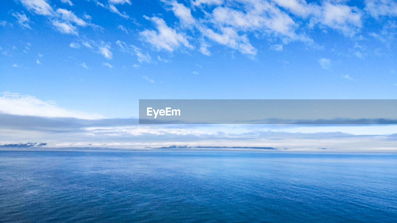 SCENIC VIEW OF SEASCAPE AGAINST SKY