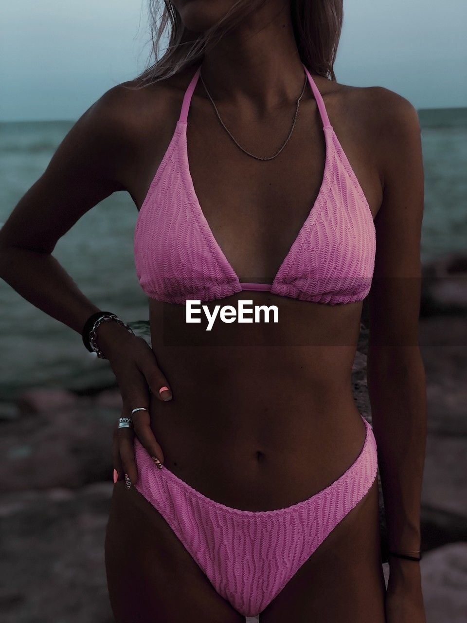 midsection of woman wearing bikini