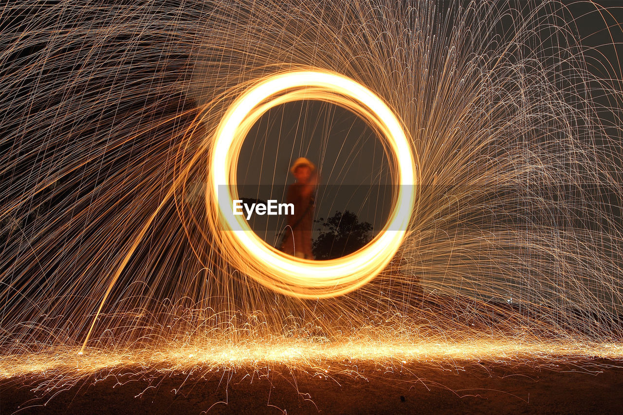 Man seen through wire wool at night